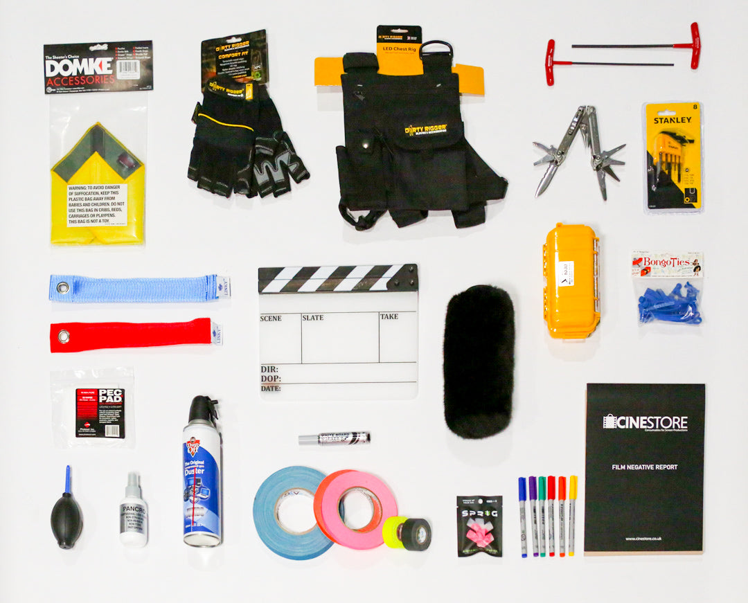 flat lay of various consumables including a clapperboard, gloves, gaffer tape and lens cleaning